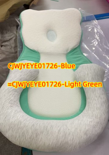 baby sleeping in soft baby lounger travel bed