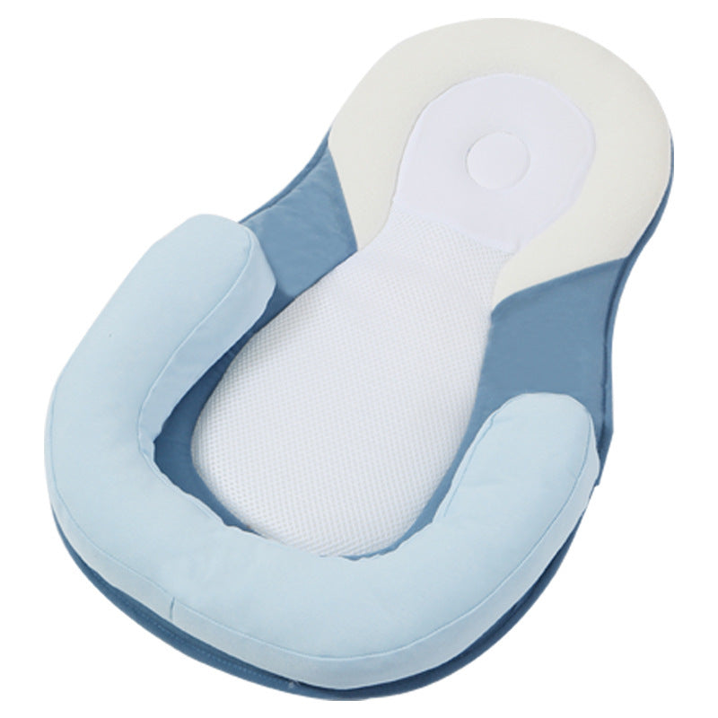 baby sleeping in soft baby lounger travel bed