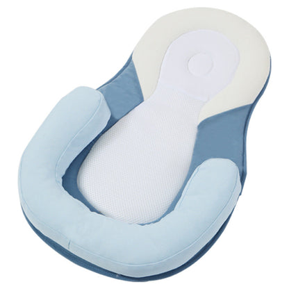 baby sleeping in soft baby lounger travel bed