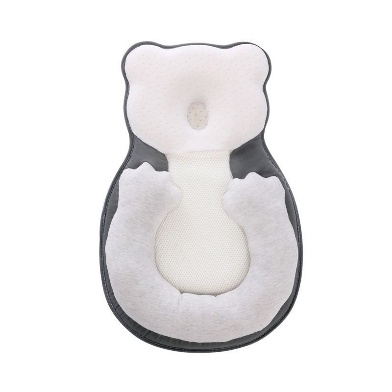 baby sleeping in soft baby lounger travel bed