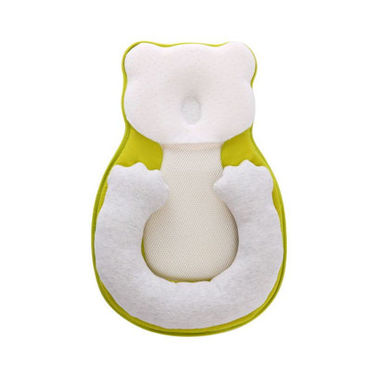baby sleeping in soft baby lounger travel bed