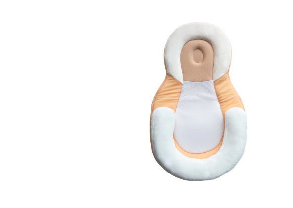 baby sleeping in soft baby lounger travel bed