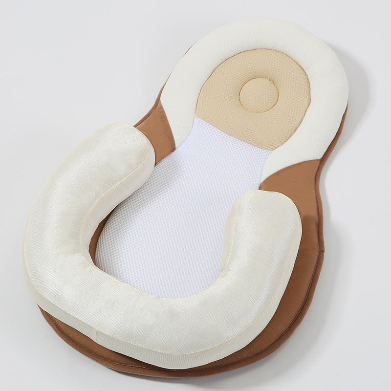 baby sleeping in soft baby lounger travel bed