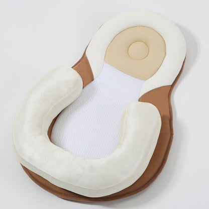 baby sleeping in soft baby lounger travel bed