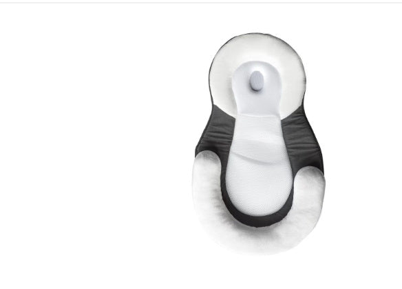 baby sleeping in soft baby lounger travel bed