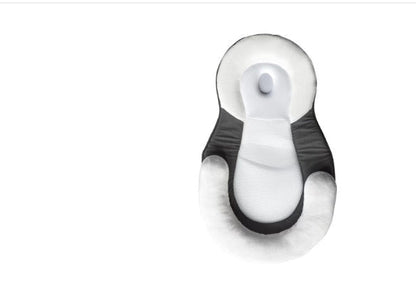 baby sleeping in soft baby lounger travel bed