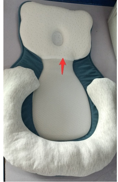 baby sleeping in soft baby lounger travel bed