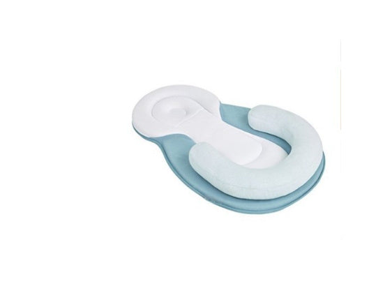 baby sleeping in soft baby lounger travel bed